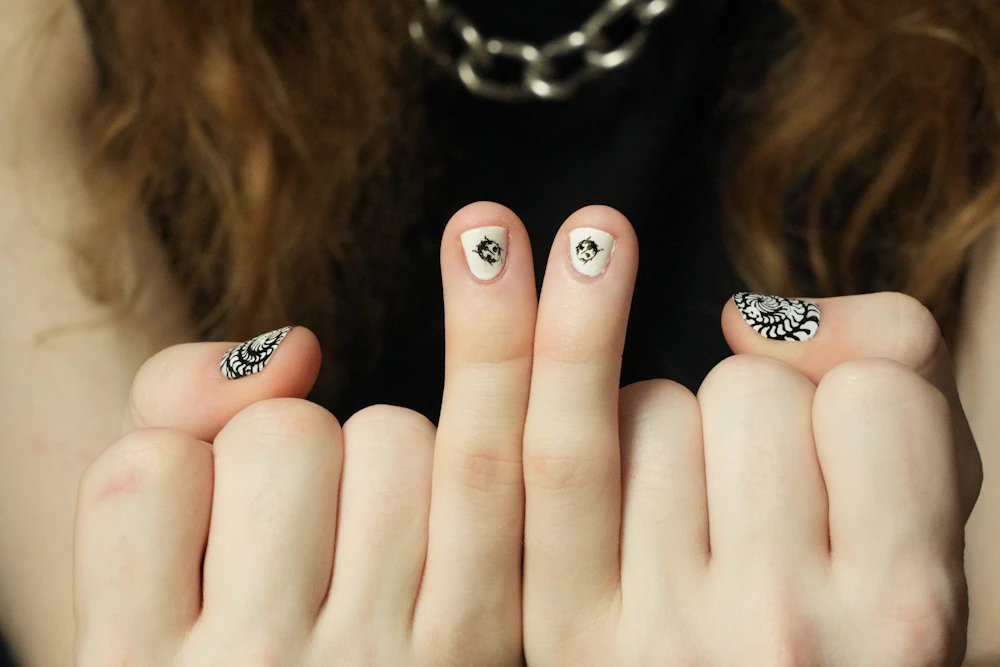 Short nails with black graphic nail art